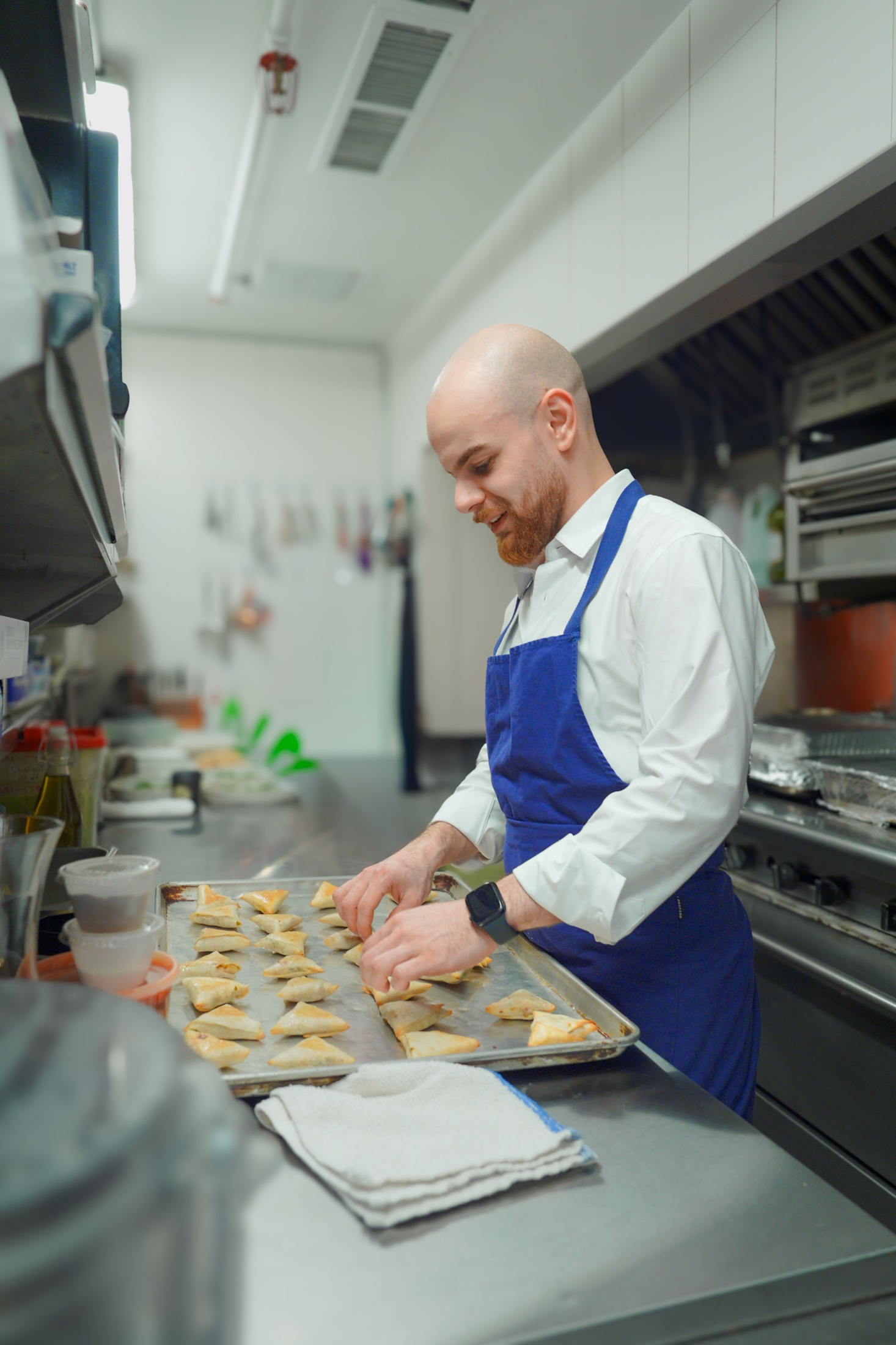 Chef Mohannad Jaradat working in a professional kitchen